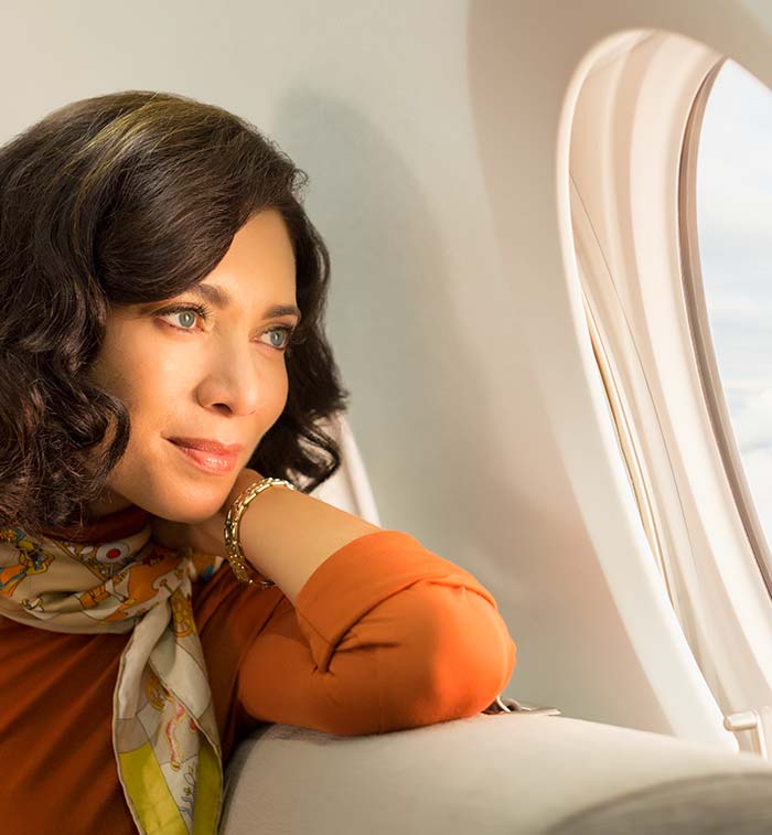 Woman looking out aircraft window