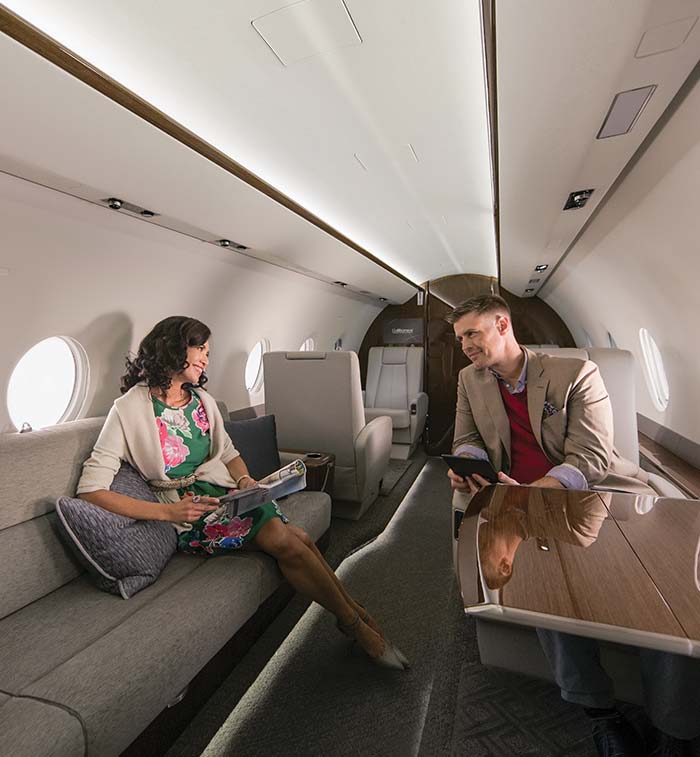 Man and Woman talking inside private aircraft