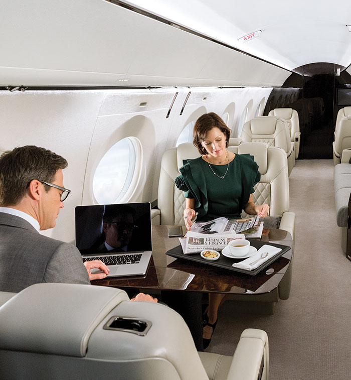 Man and woman inside business aircraft