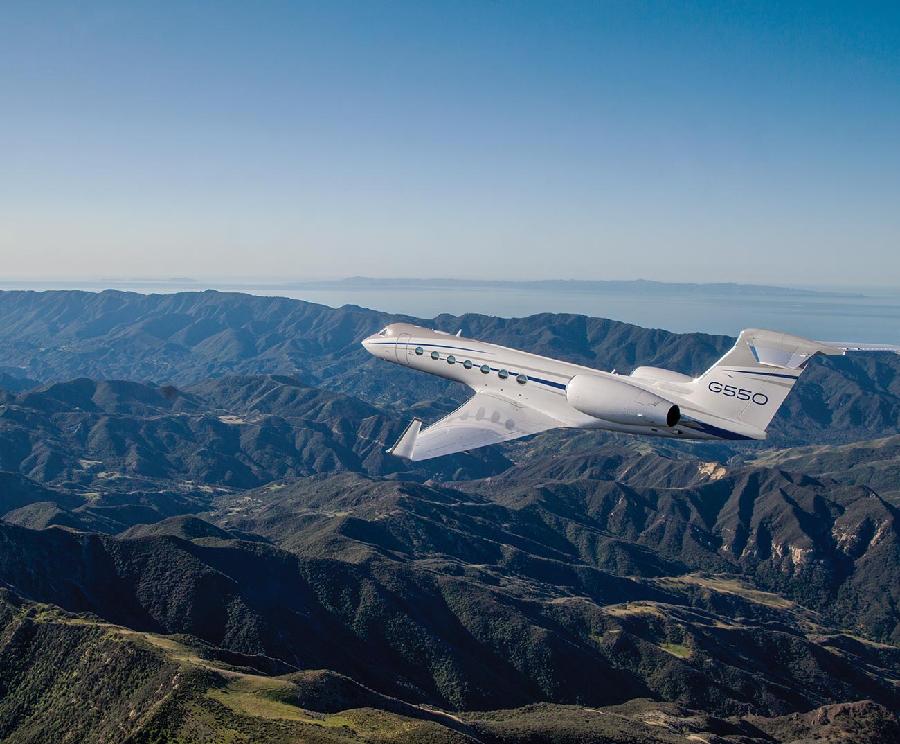 G550 flying over bumpy mountains