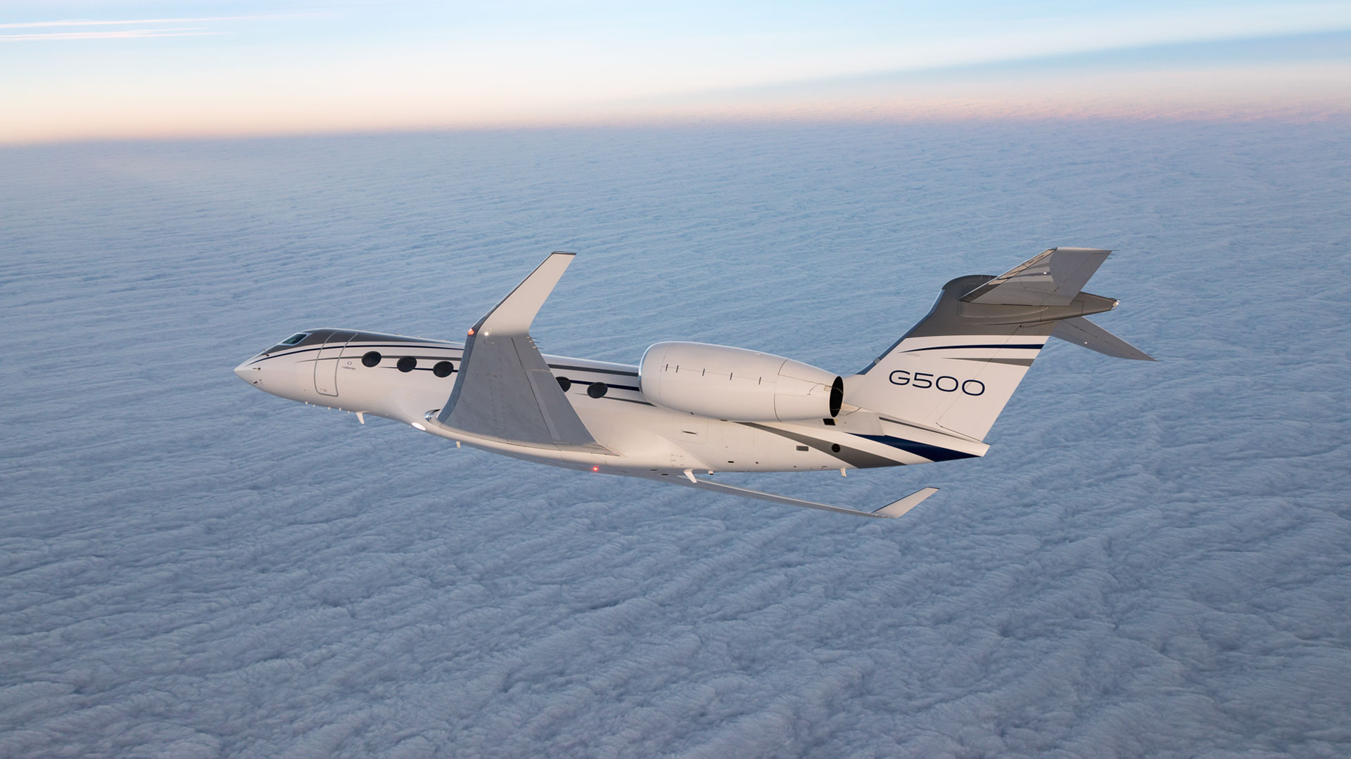 G500 flying over clouded sky.