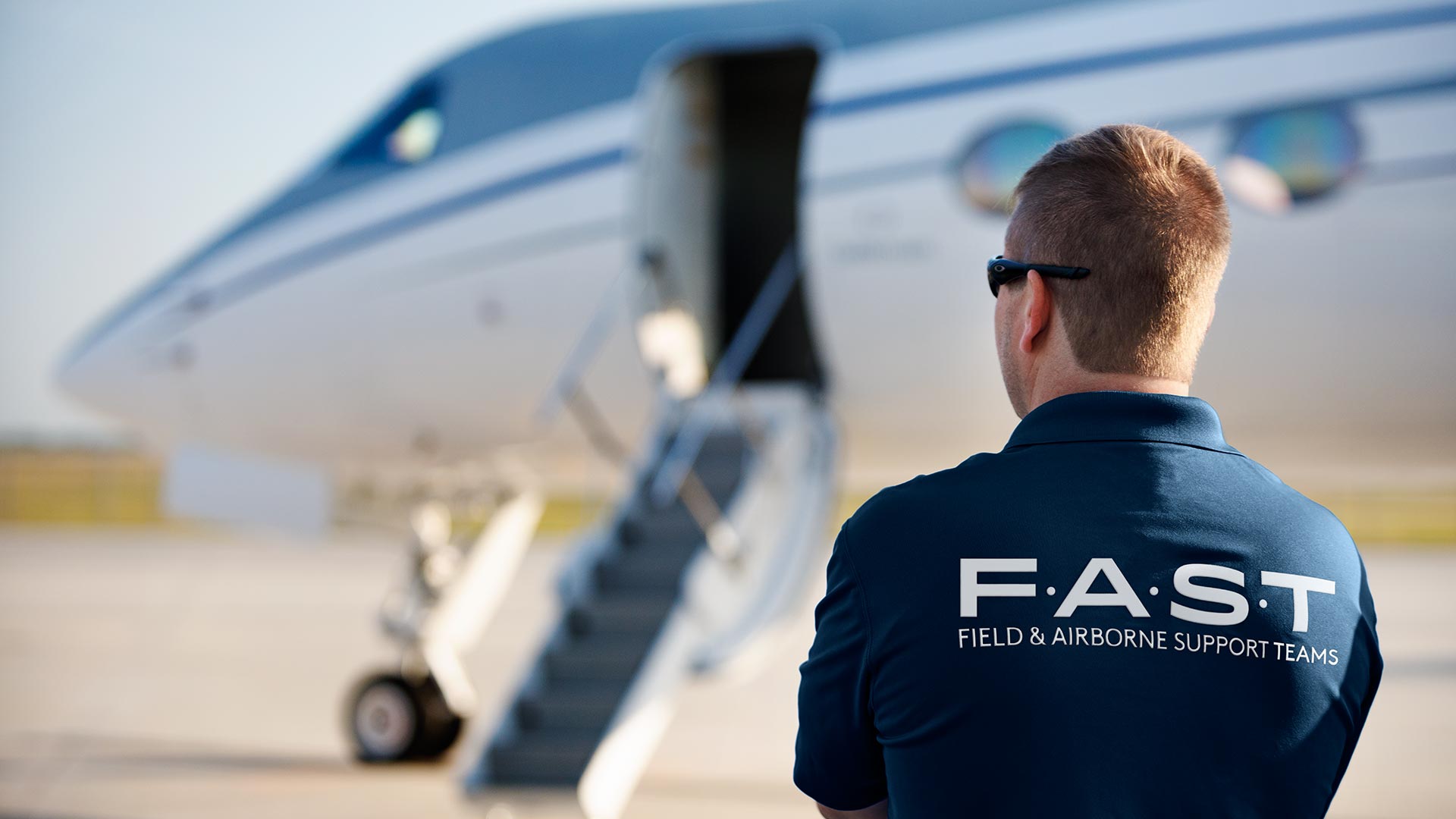 Gulfstream FAST technician overlooking the runway.