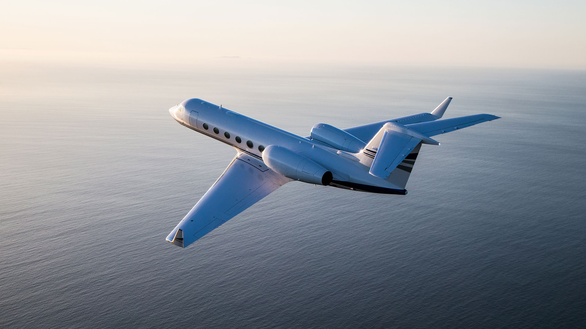 Preowned aircraft flies over water